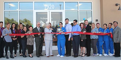 SJVC Delano staff and students, along with Delano community members, celebrated the official ribbon cutting. Pictured at the center are campus director Patricia Hruby and Medical Assisting student Jalyssa Alvarado,