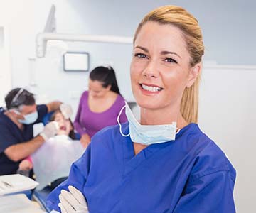 Dental hygienist working in dental office
